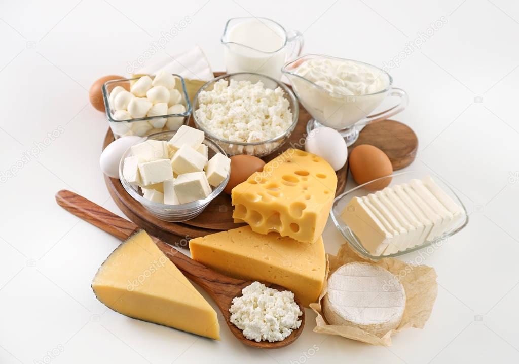 Fresh dairy products and eggs on white background