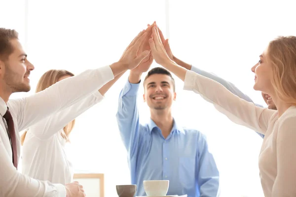 Young people putting hands together — Stock Photo, Image