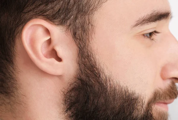 Young man with hearing problem — Stock Photo, Image