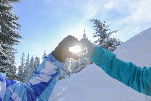 couple holding hands in shape of heart