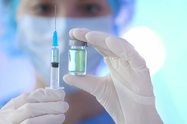 Doctor holding syringe and medicine Royalty Free Stock Photos
