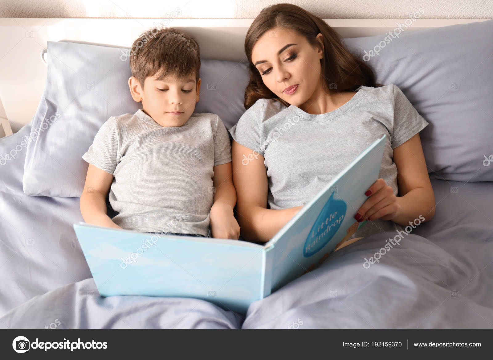 Mother Reading Bedtime Story Son Home — Stock Photo © belchonock 192159370