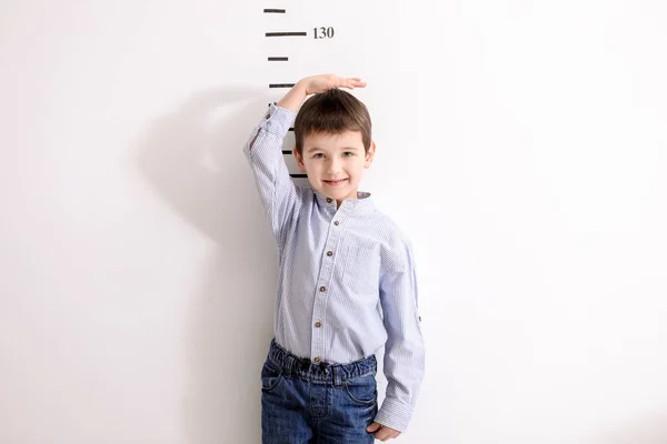 Little Boy Measuring Height White Wall — Stock Photo, Image