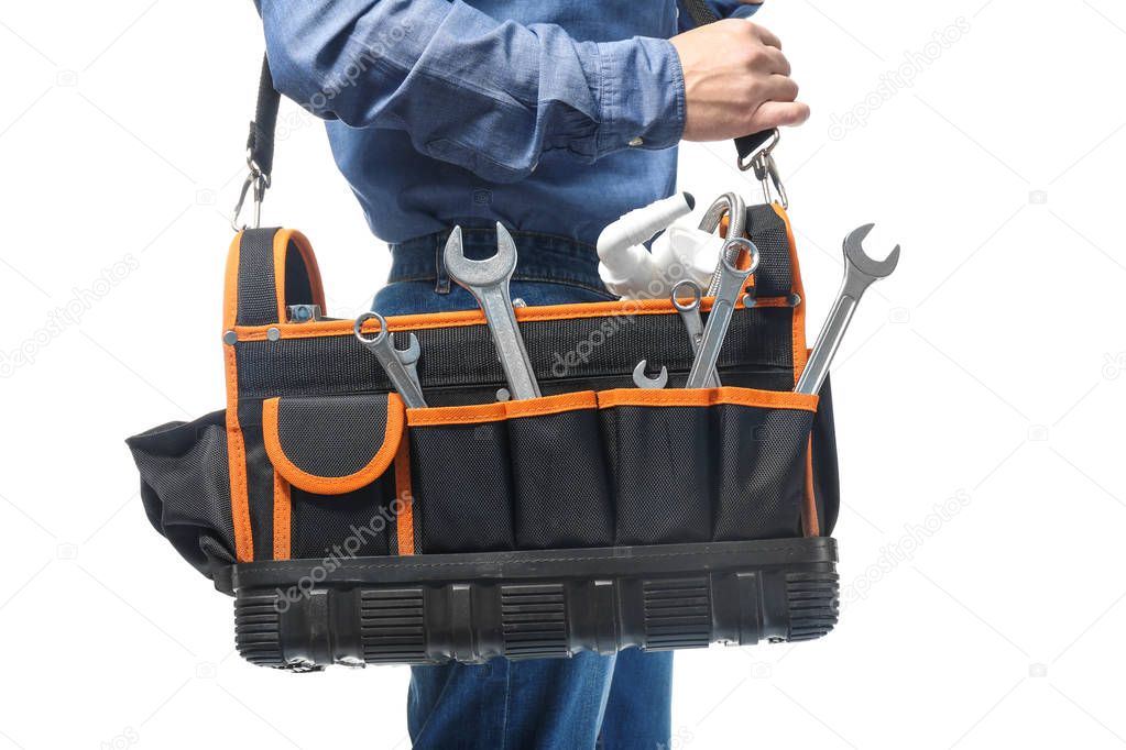 Plumber with tool bag on white background, closeup