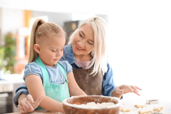 Girl and grandmother with flour and dough — Stock Photo, Image