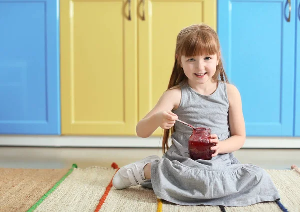 Little girl with jar of jam — Stock Photo, Image