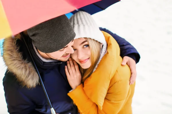Young romantic couple with umbrella — Stock Photo, Image