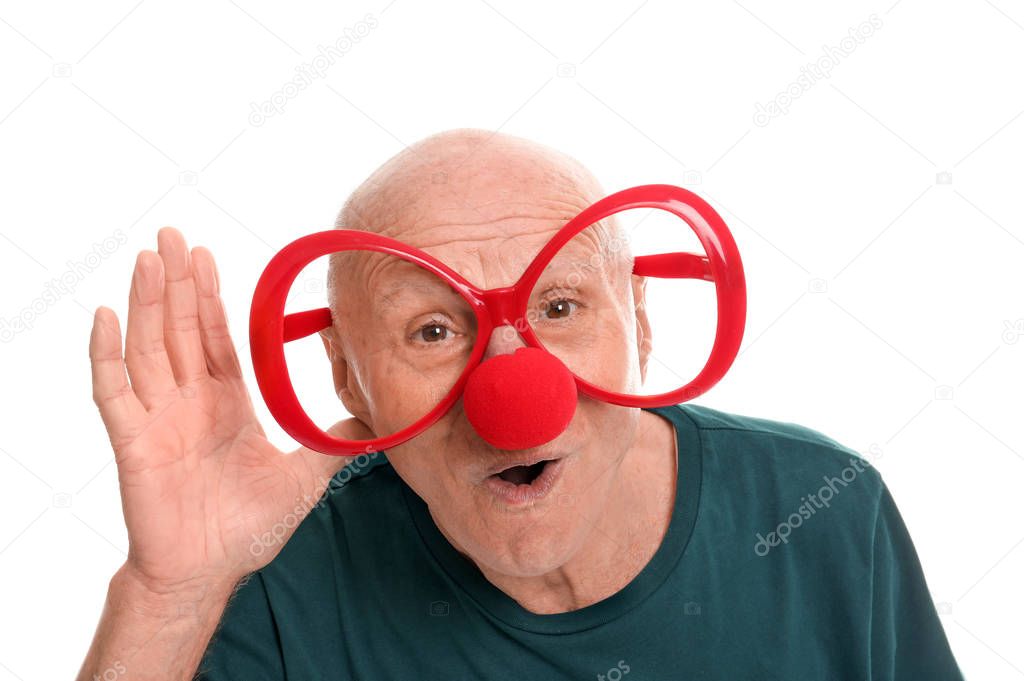 Mature man in funny disguise on white background. April fool's day celebration