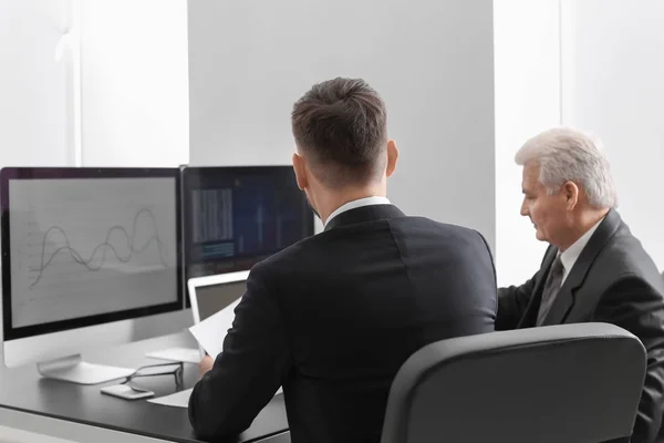 Male brokers working in office — Stock Photo, Image