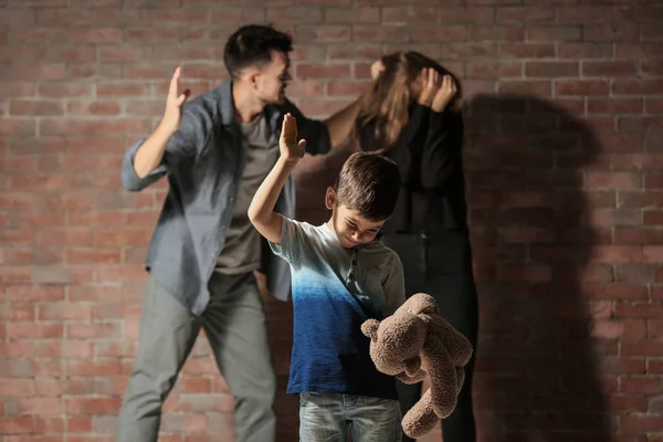 Little Boy Punishing Teddy Bear While Parents Having Fight Background — Stock Photo, Image