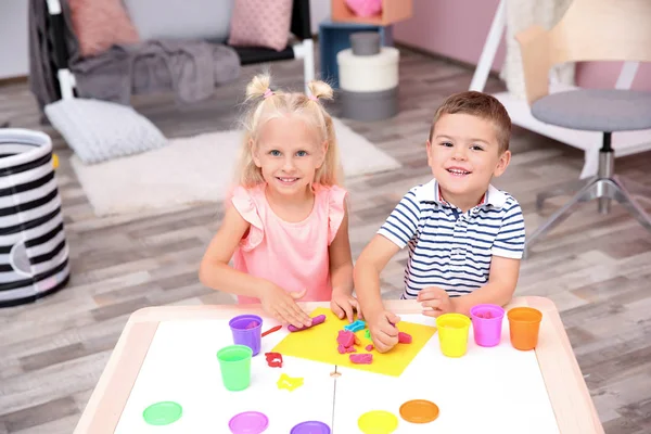 Cute Little Children Modeling Playtough Home — стоковое фото