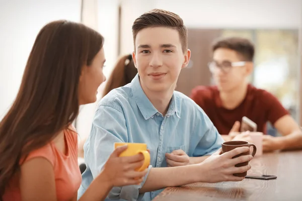 Cool teenagers in cafe — Stock Photo, Image