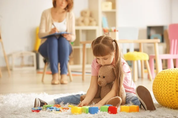 Cute little girl during play therapy