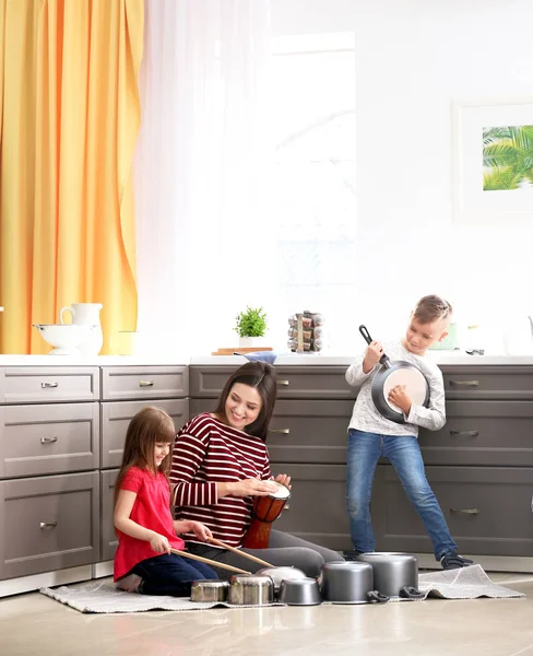 Family playing with kitchenware — Stock Photo, Image