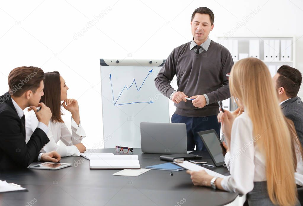 Group of people with business trainer 