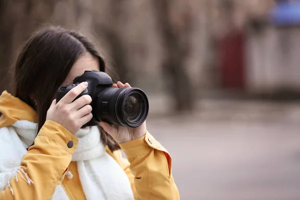 Young photographer with camera — Stock Photo, Image