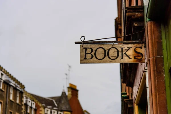 Old fashioned wooden bookshop sign — Stock Photo, Image