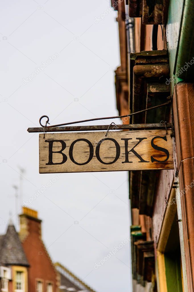 old fashioned wooden bookshop sign