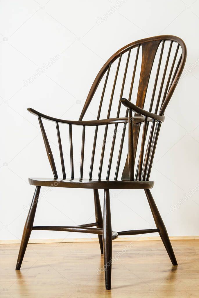 Single Windsor style chair in empty room UK