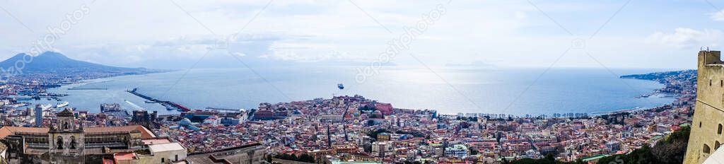 Naples, Italy cityscape with blue sky and mount Vesuvius on background