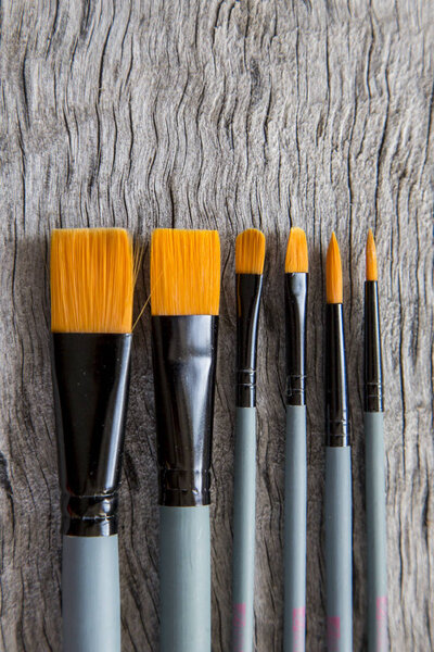 Painting tools. Set of brushes with orange bristle 