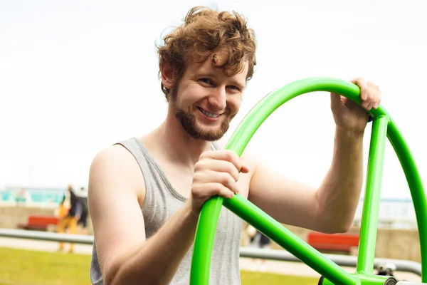 Active man exercising with tai chi wheel. — Stock Photo, Image