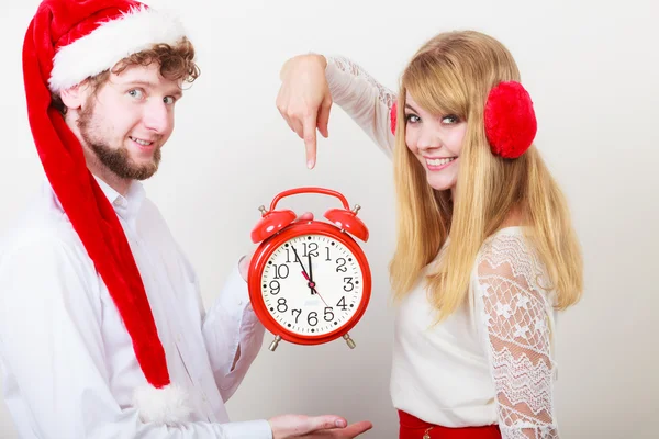 Happy couple woman and man with alarm clock. — Stock Photo, Image