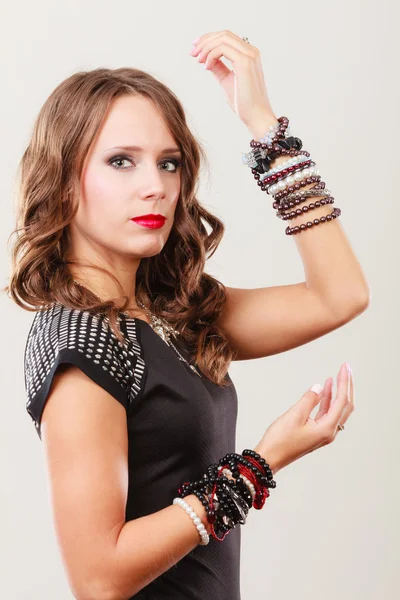 Woman with jewellery in black evening dress — Stock Photo, Image