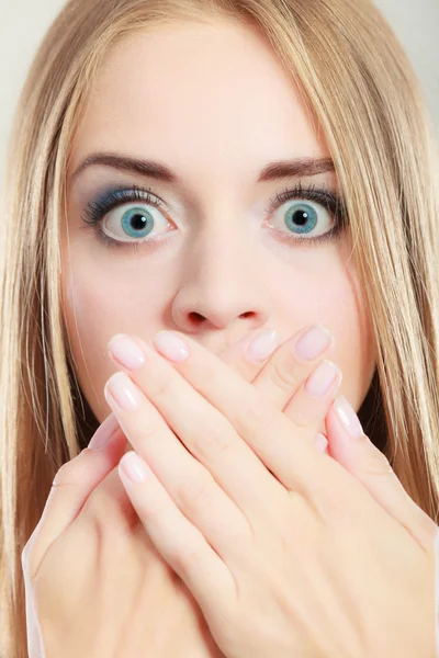 Amazed woman covering her mouth with hands — Stock Photo, Image