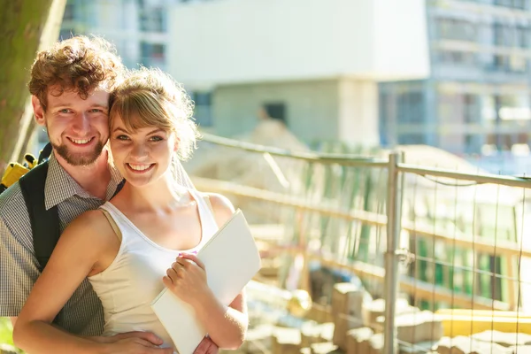 Couple with blueprint project outdoor — Stock Photo, Image