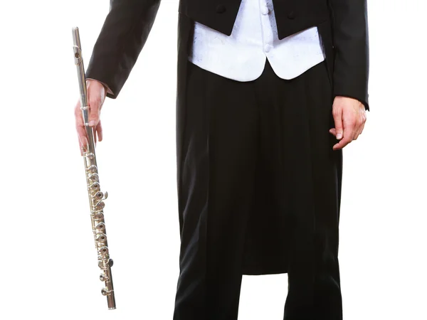 Male flutist wearing tailcoat holds flute — Stock Photo, Image