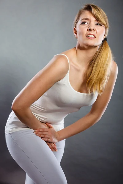 Woman with hands holding her crotch — Stock Image Woman with hands holding her crotch Stock Photo