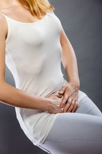 Woman with hands holding her crotch — Stock Image Woman with hands holding her crotch Stock Photo