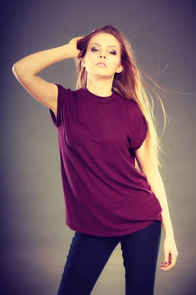 Attractive brunette woman with windblown hair — Stock Photo, Image