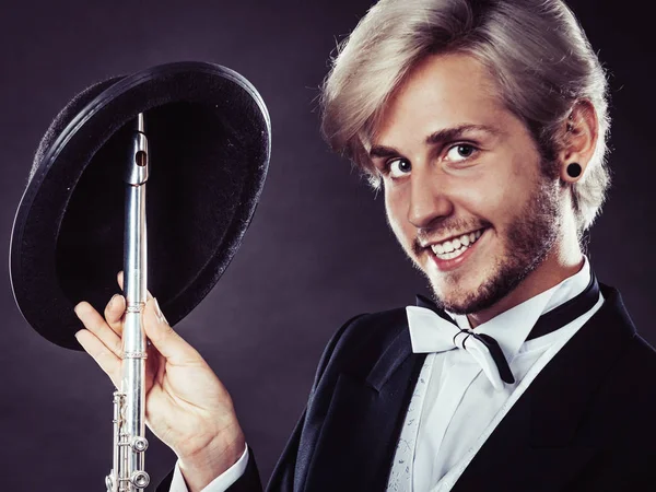 Elegantly dressed musician holding flute — Stock Photo, Image