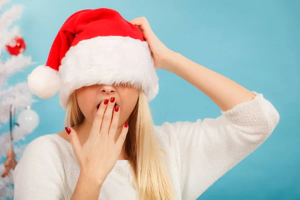 Sleepy woman in santa claus hat — Stock Photo, Image