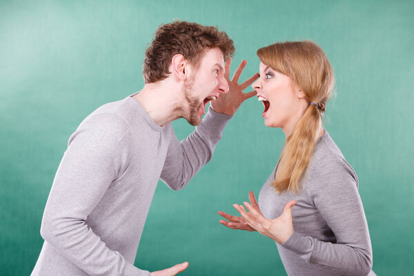 Husband and wife yelling and arguing.