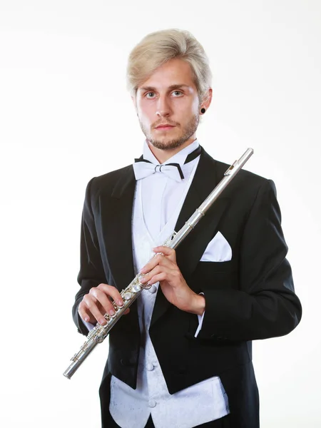Flautista masculino con chaleco trasero sostiene flauta — Foto de Stock