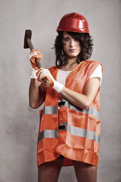 Sexy girl in safety helmet holding hammer tool — Stock Photo, Image