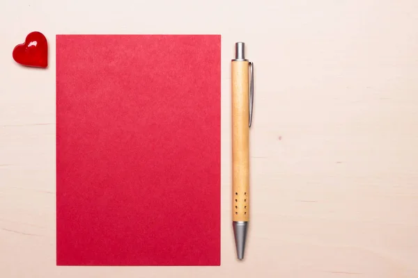 Blank sheet of paper heart and pen on table — Stock Photo, Image