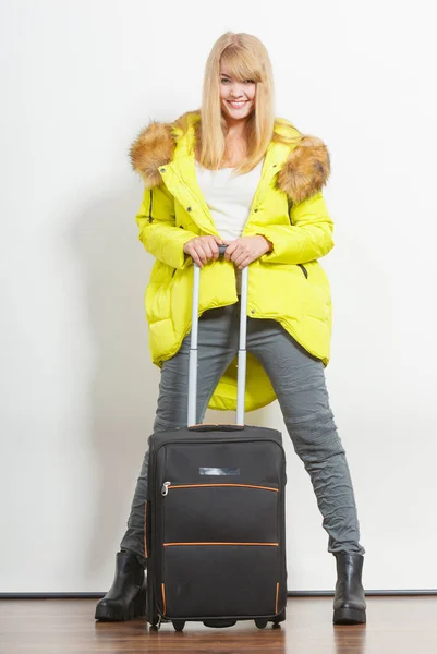 Woman in warm jacket with suitcase. — Stock Photo, Image