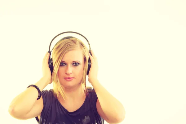 Blonde girl in big headphones. — Stock Photo, Image