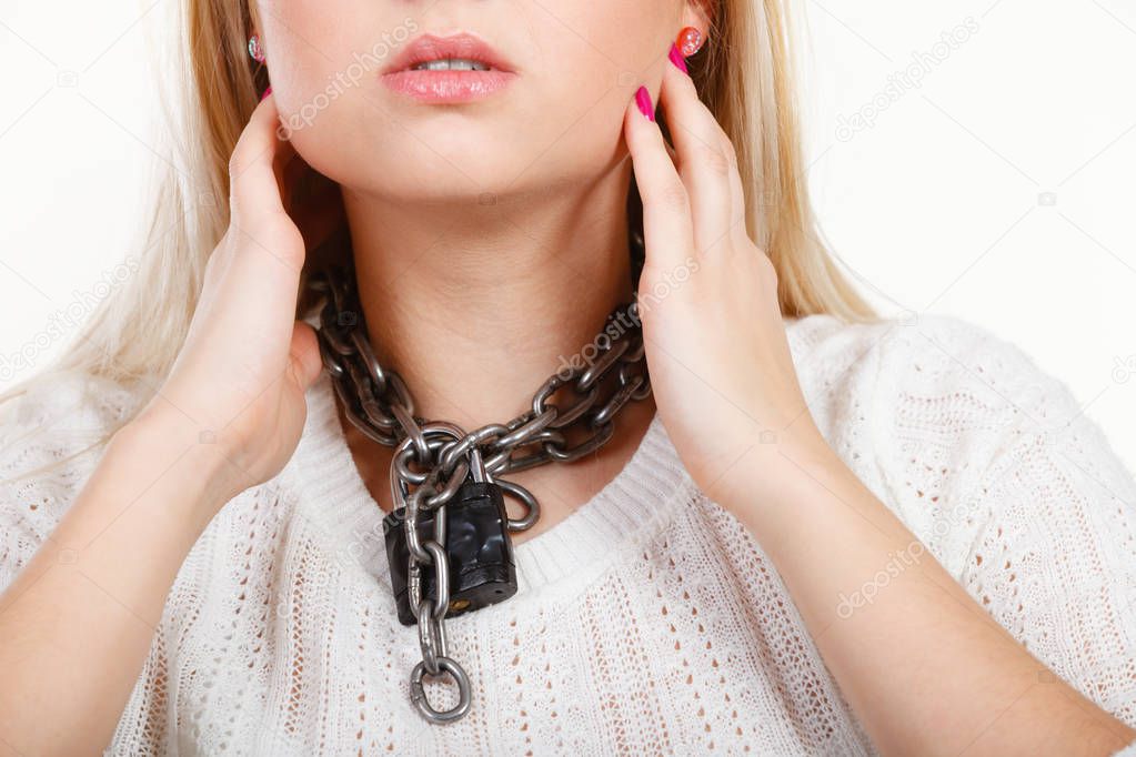 Woman having metal chain around neck