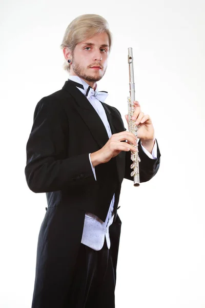 Male flutist wearing tailcoat holds flute — Stock Photo, Image