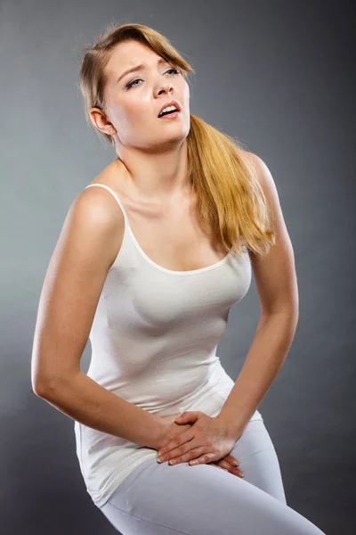 Woman with hands holding her crotch — Stock Image Woman with hands holding her crotch Stock Picture