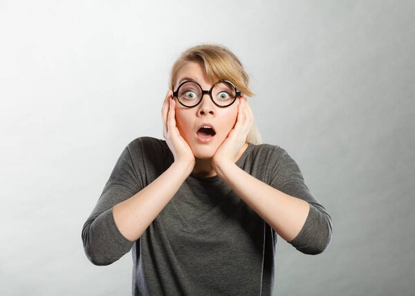 Surprised astonished girl with open mouth.