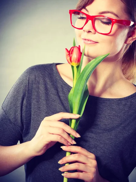 Charming woman smelling flower feel peace.