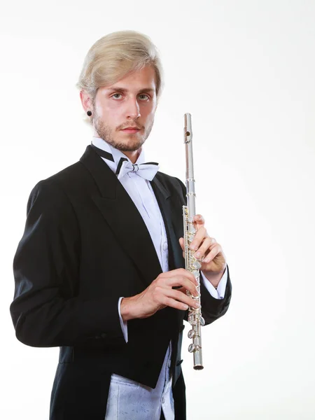 Flautista masculino con chaleco trasero sostiene flauta — Foto de Stock