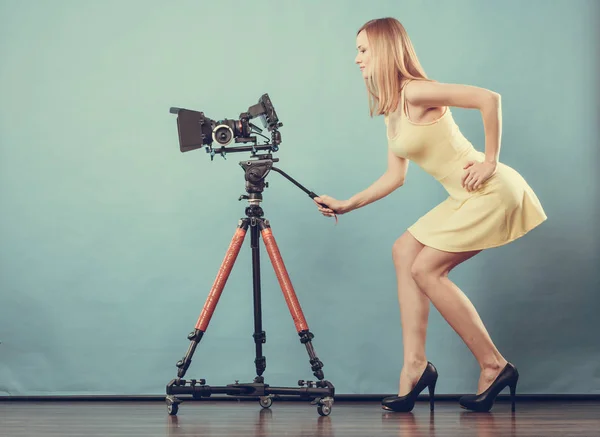 Photographer woman with camera taking photos