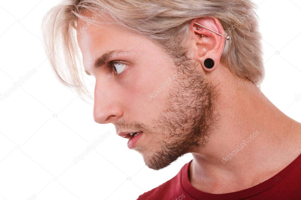 Teen boy with piercing and fashionable hairstyle